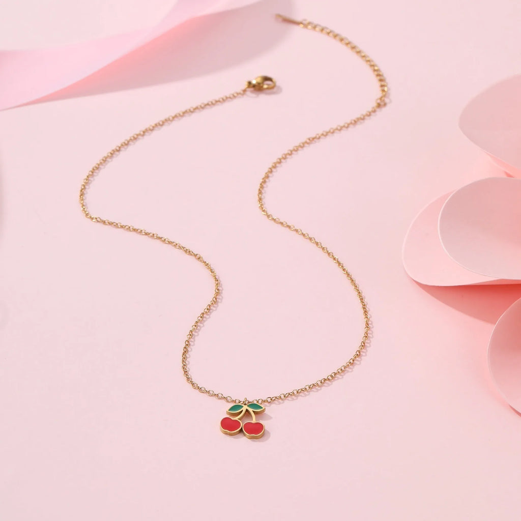 Cherry charm jewellery set showing necklace, bracelet, earrings, and ring in 18K gold plated stainless steel