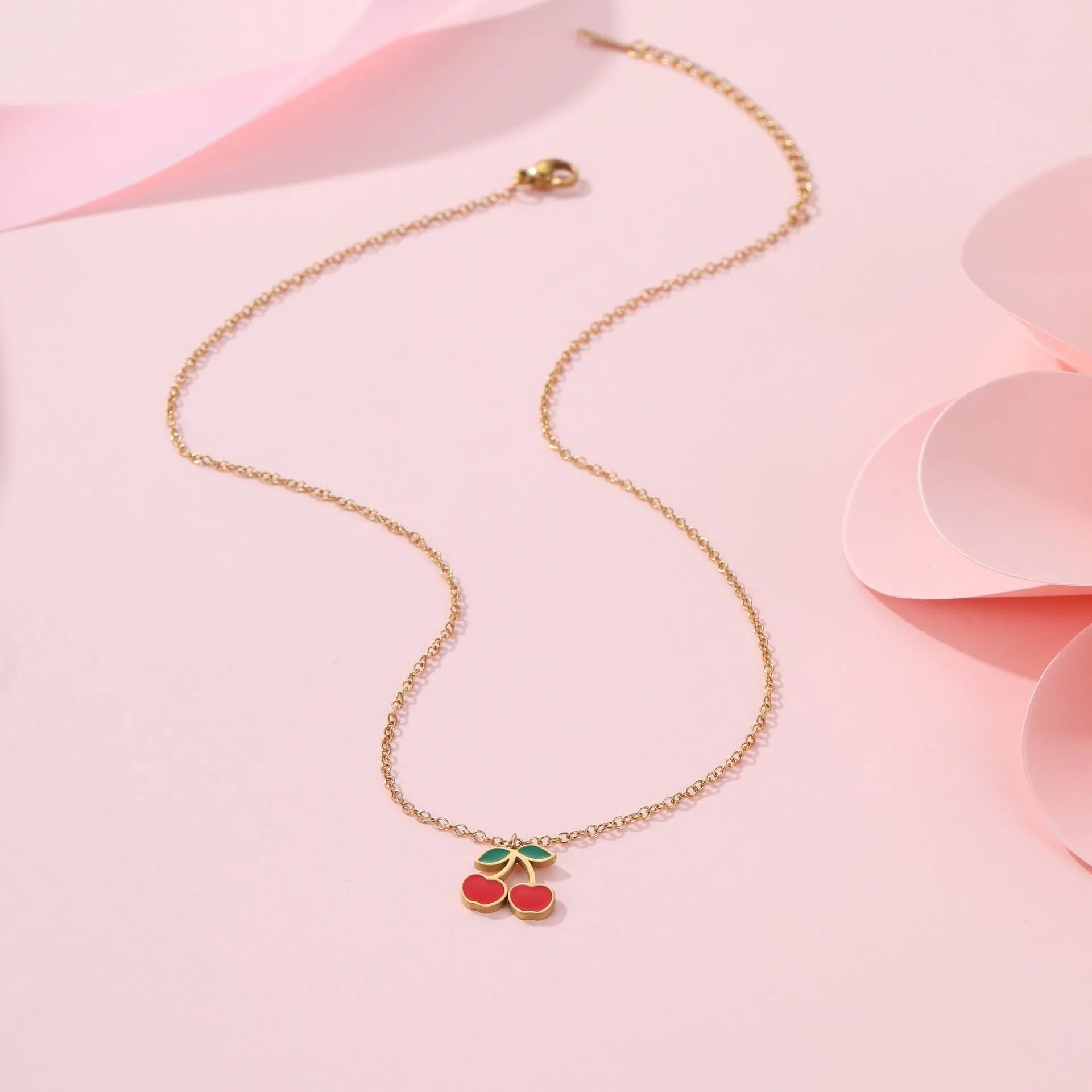 Cherry charm jewellery set showing necklace, bracelet, earrings, and ring in 18K gold plated stainless steel
