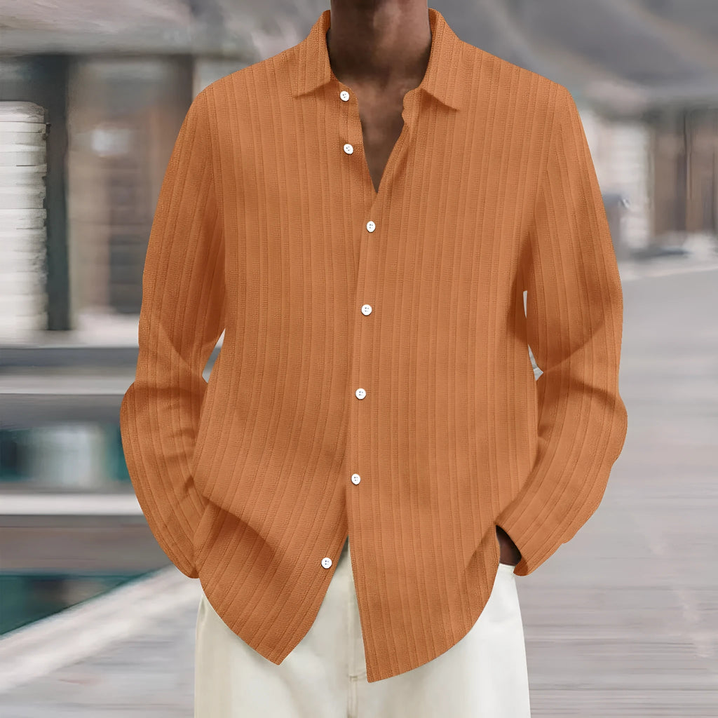 Man wearing a loose-fit, striped, long-sleeve cardigan in a blue colour variant