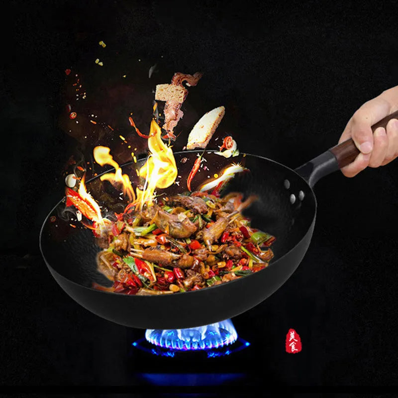 Black traditional iron wok with wooden handle measuring 40cm diameter