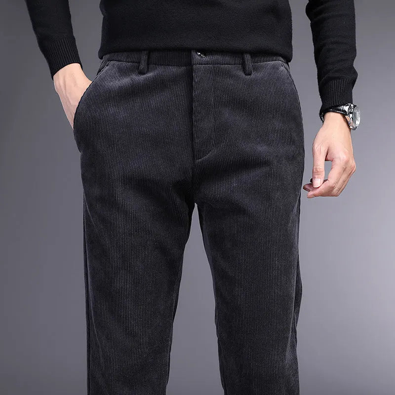 British retro striped straight-leg men's trousers in a dark colour, laid flat to show the zip fly and full length.