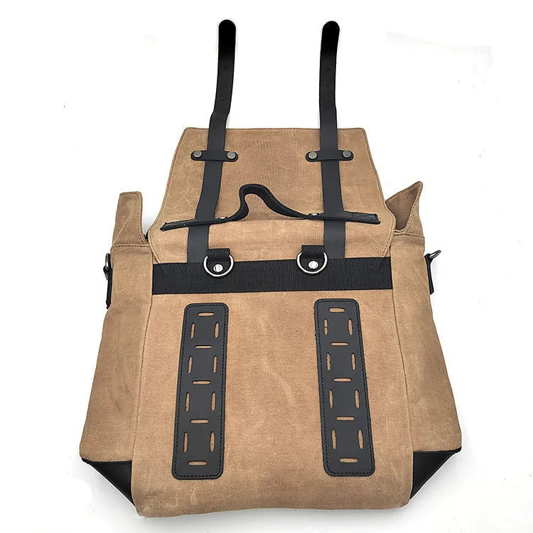 Waterproof canvas motorcycle side bag in black with cowhide accents and mounting straps