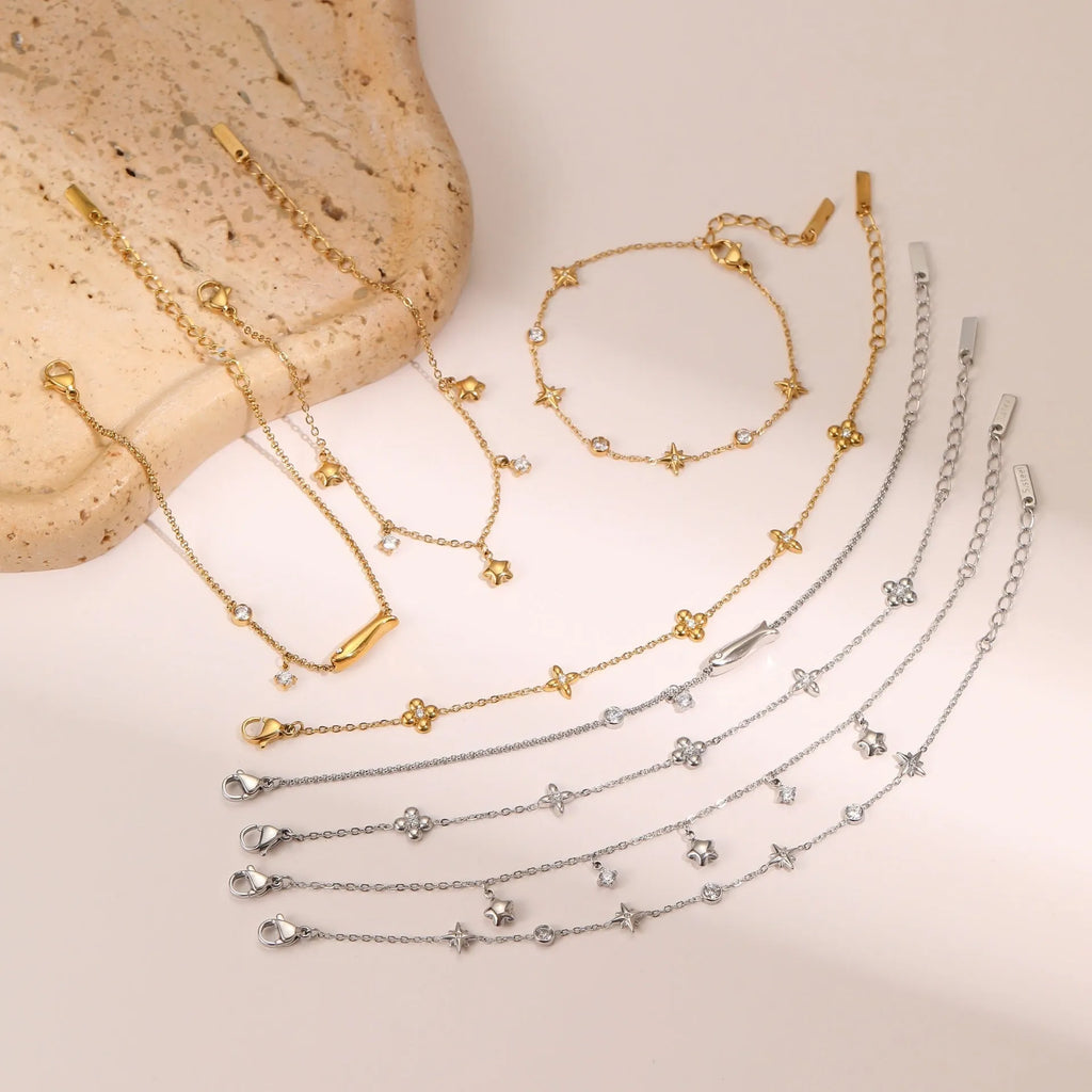 Gold-plated titanium steel bracelet with geometric star pendant featuring zircon detailing