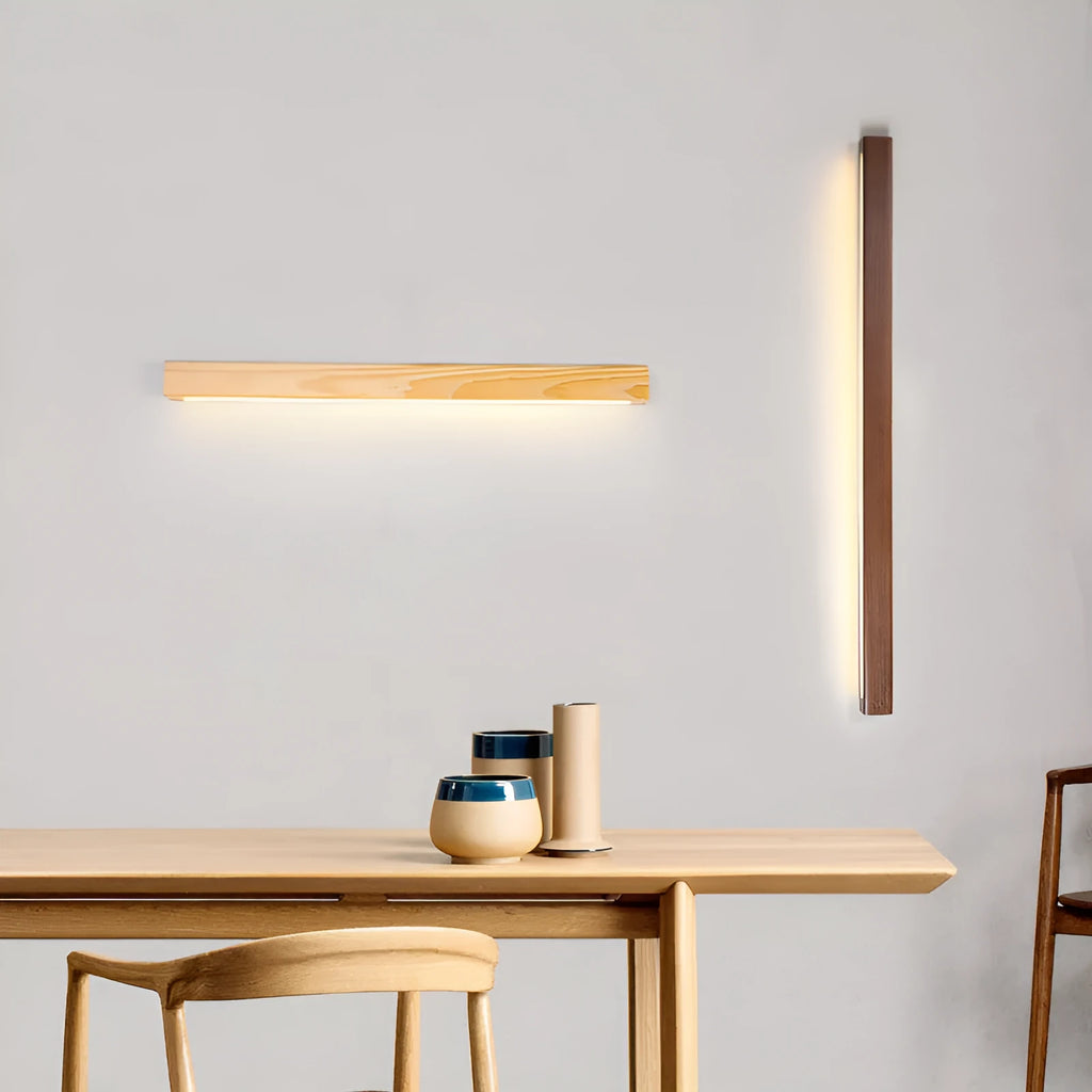 Walnut colour solid wood and acrylic LED strip wall lamp in three different lengths.