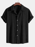 Man wearing a loose-fit black short sleeve casual cardigan for summer.