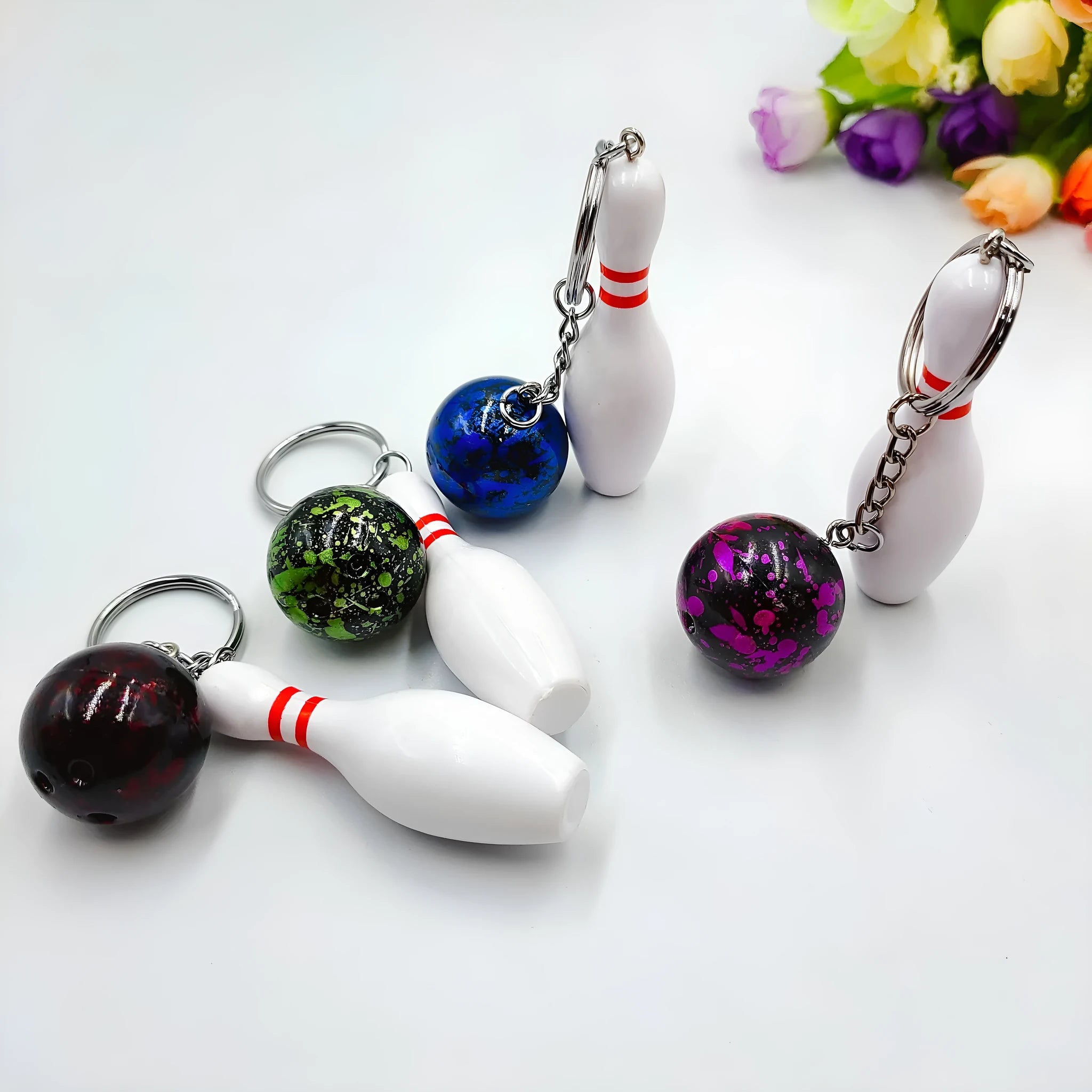 Mini bowling ball simulation keychain pendant in dark red, blue, purple and green colour options
