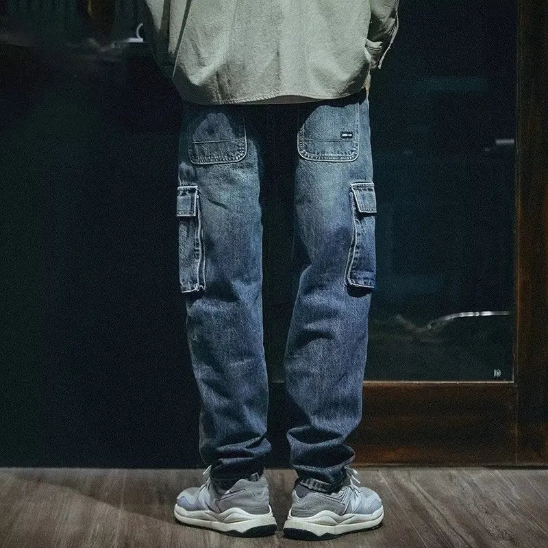 Men's blue loose straight-leg stretch denim casual trousers on a plain background