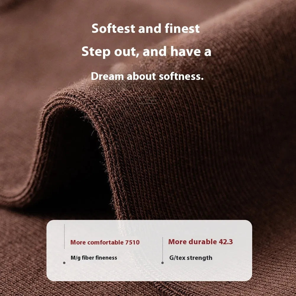 A pair of men's solid colour mid-calf socks made from combed cotton, shown in a light grey hue.