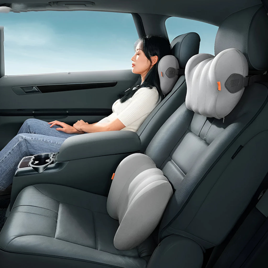 Grey and orange car head rest and waist pillow set with memory cotton filler on a car seat.