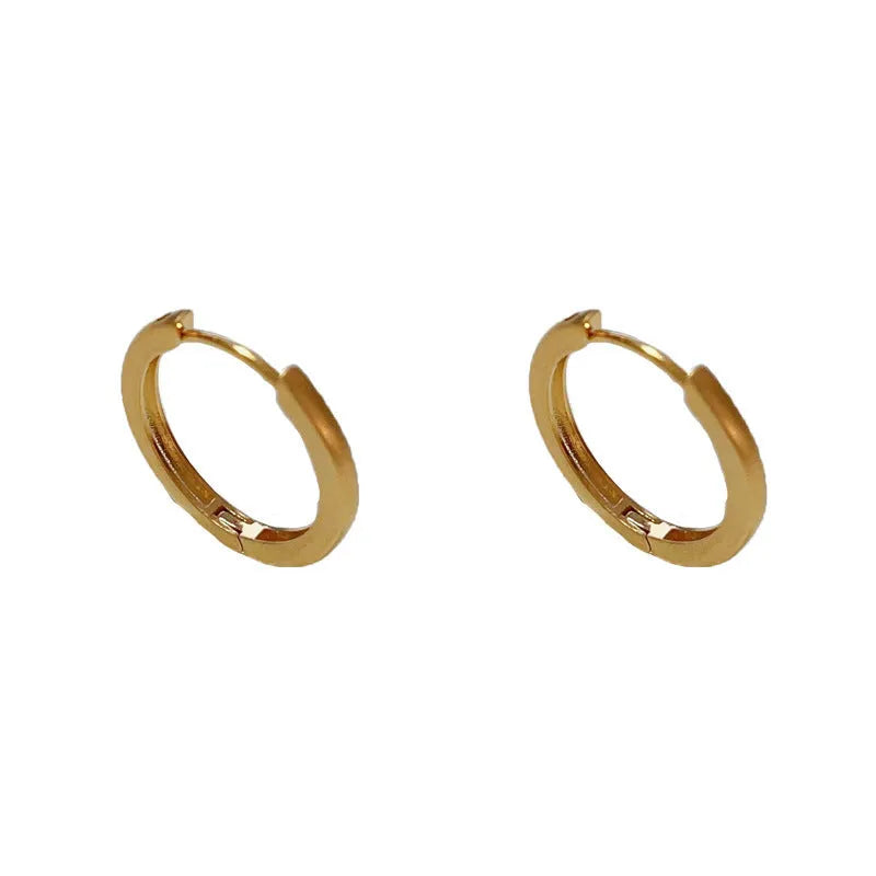 Geometric circular ear clips with gold plating in gold and silver colour options