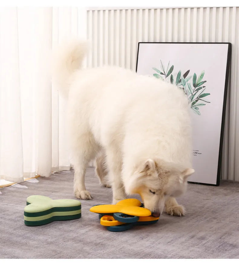Green interactive dog puzzle bowl with bone-shaped covers on a non-slip base.