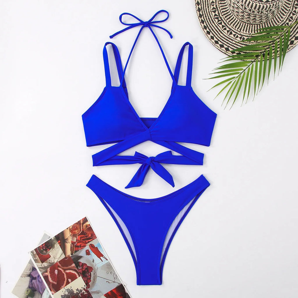 Women's solid colour brief bikini swimsuit on a hanger, showing sleeveless design.