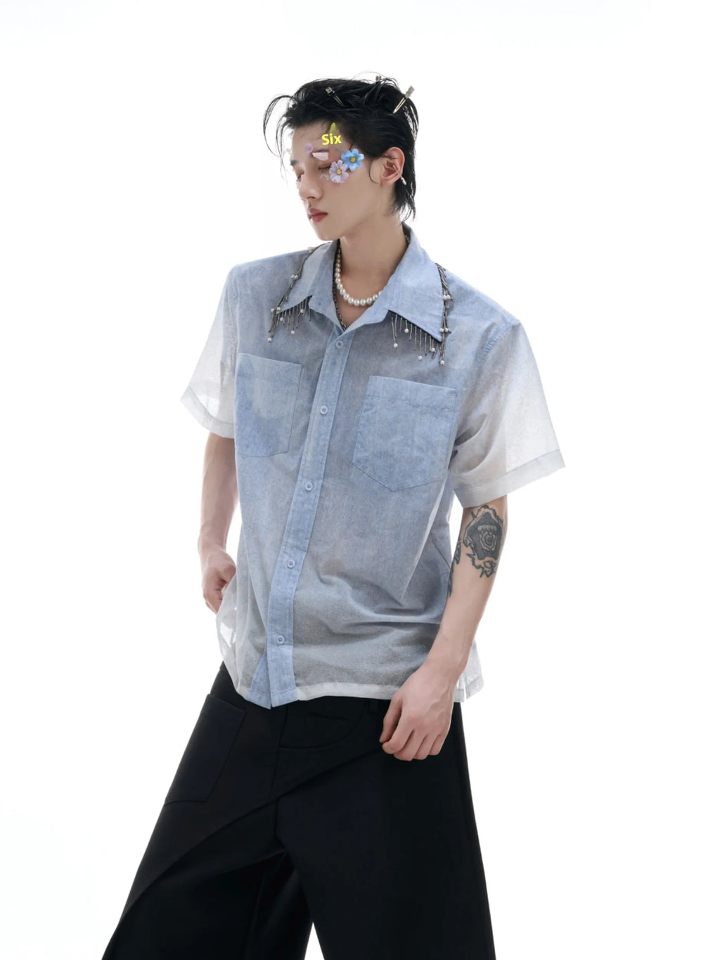 Man wearing a loose-fit gradient blue short-sleeved polyester casual shirt.