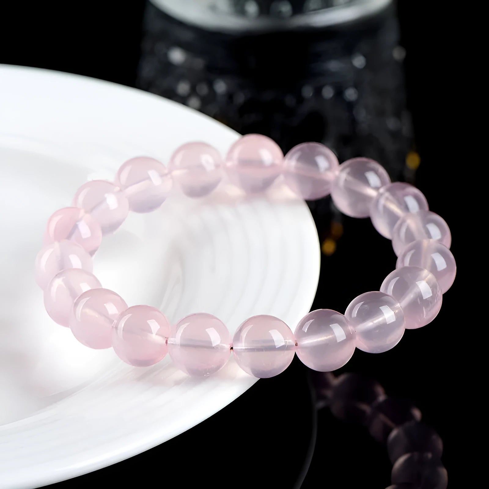 Women's natural starlight crystal bracelet with polished round pink beads in single circle configuration