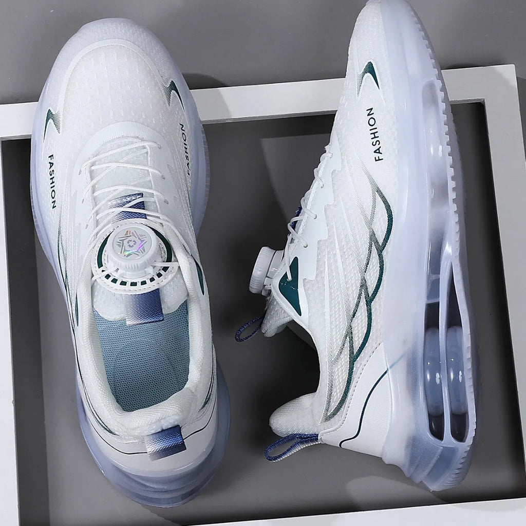 White low-top casual sports shoes with rotating button lace-up and mesh upper on a rubber sole.