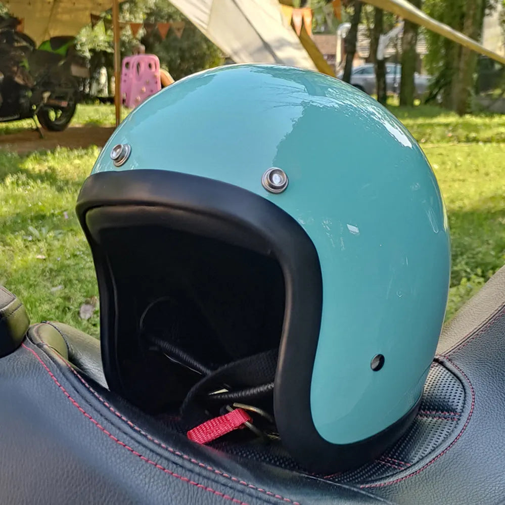 Retro-style fibreglass motorcycle half helmet shown in cement grey colour option