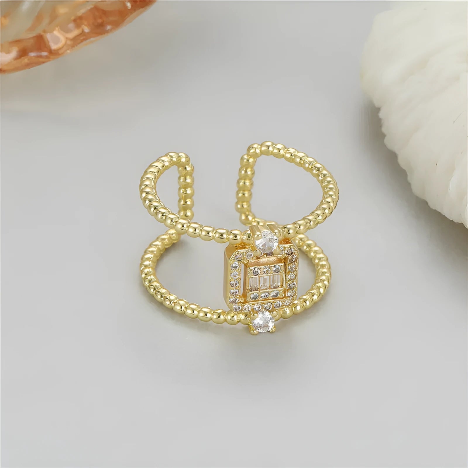 Copper open ring with adjustable opening and asymmetric U-shaped design in gold finish