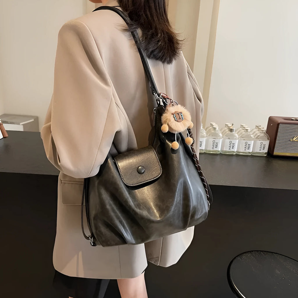Textured PU leather women's single shoulder bag in horizontal square shape with optional pendant detail