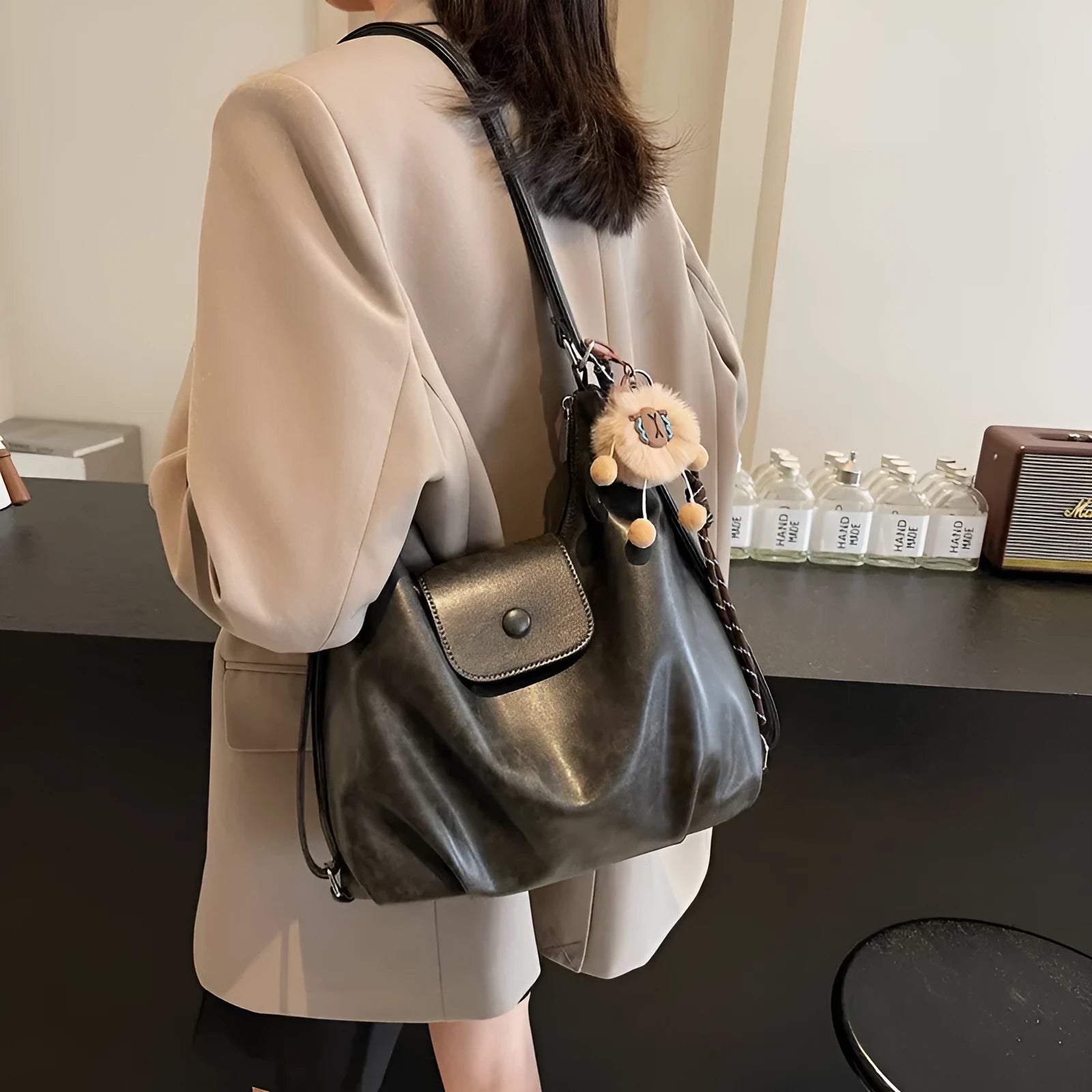 Textured PU leather women's single shoulder bag in horizontal square shape with optional pendant detail