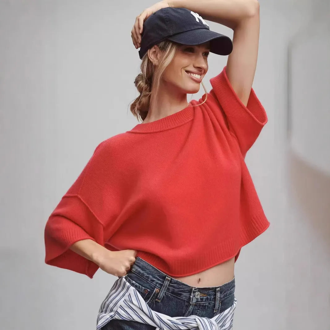 Red cropped short sleeve T-shirt with an exposed navel design on a mannequin.