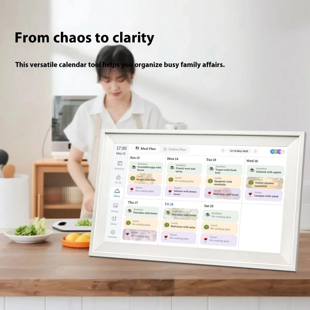White 15.6 inch smart digital photo frame with app control on a wooden desk.