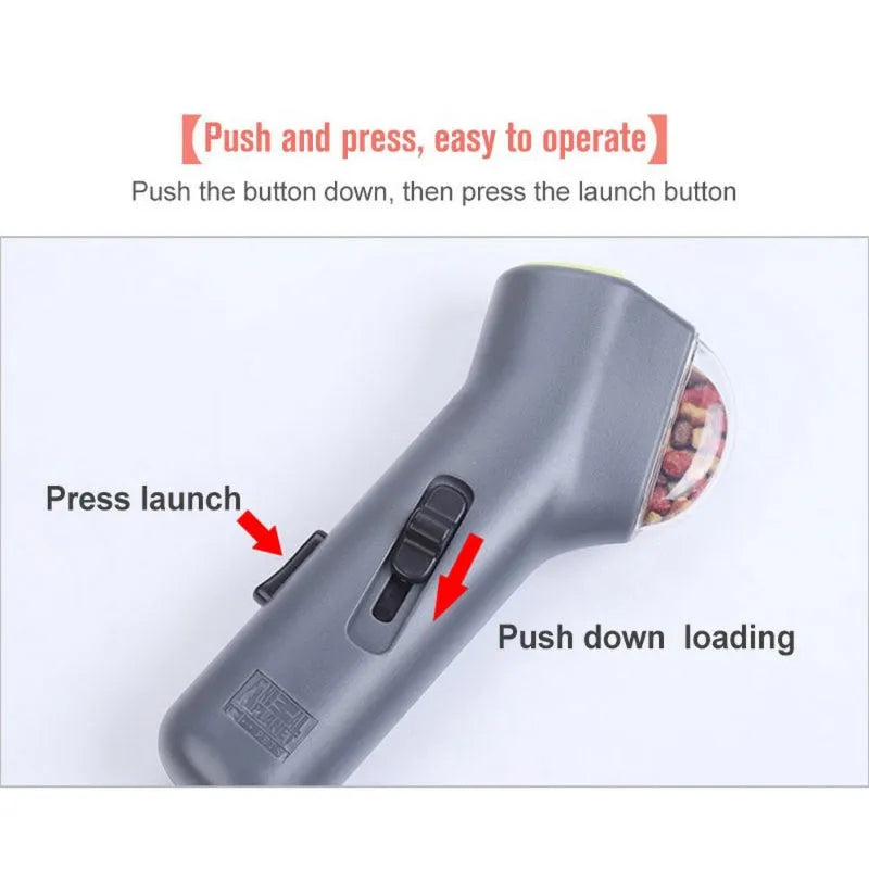 Grey plastic pet snack catapult launcher toy with a handle for dogs and cats.