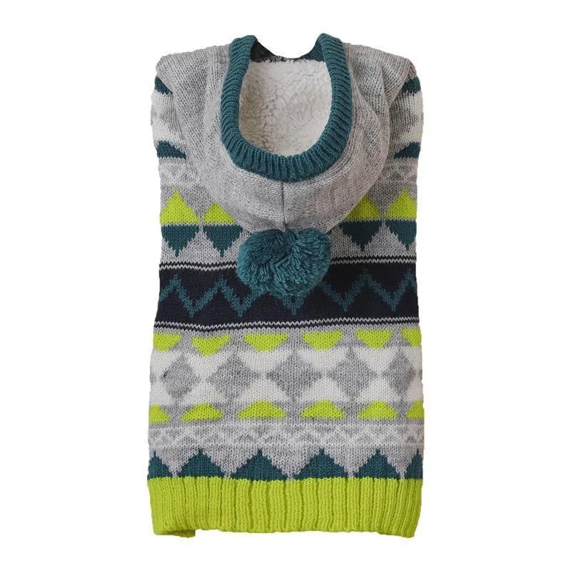 Blue knitted dog sweater with a diamond pattern on a small dog model.