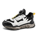 Men's black casual shoes with rotating button closure and platform sole design