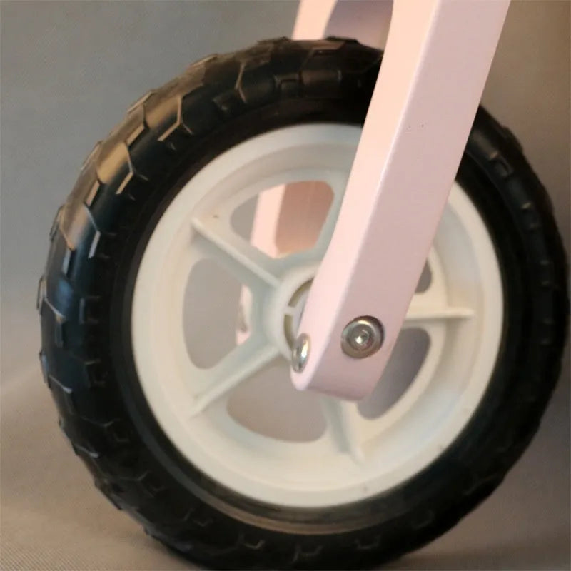 Pink wooden balance scooter for toddlers with 10-inch wooden platform