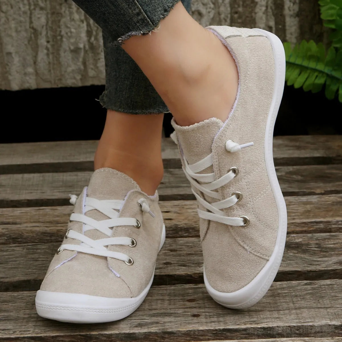 Women's creamy-white fabric casual sneakers with low-top design and rubber sole