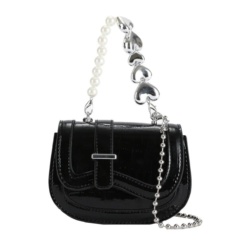 Women's mini saddle crossbody bag in horizontal square design with single shoulder strap