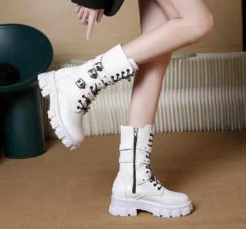 Women's black mid-calf knight boots featuring a metal buckle strap and a side zip closure.