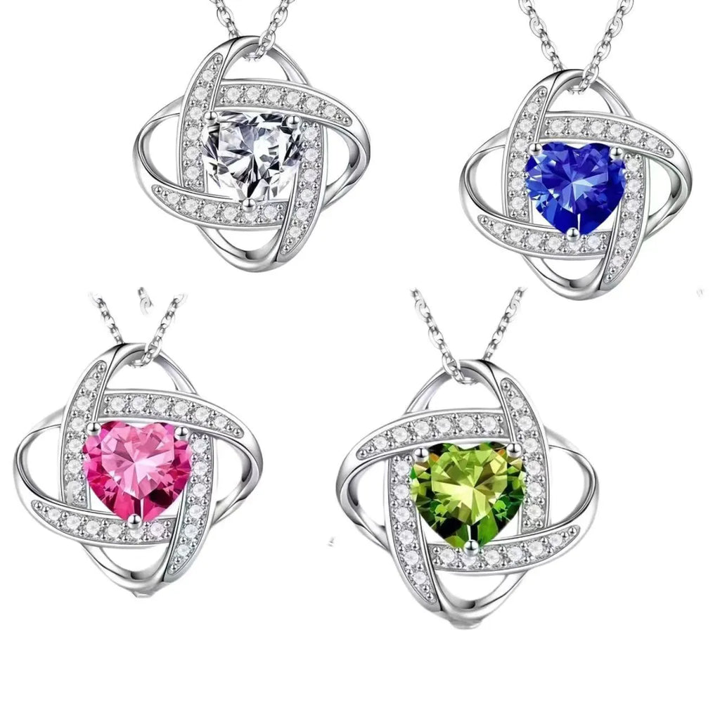 Ladies heart shape necklace in platinum electroplated colours including red diamond and dark blue diamond.
