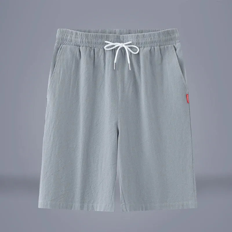 Solid colour cotton linen cropped summer pants with a drawstring waistband on a hanger.