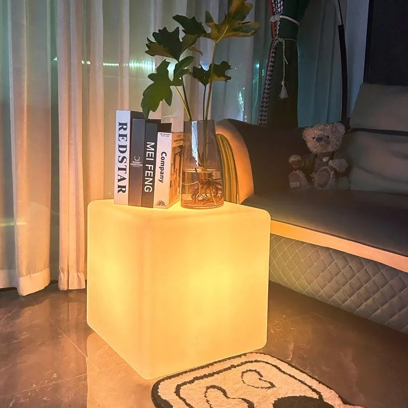 Modern square white LED cube stool light for garden patio with solar panel on top.