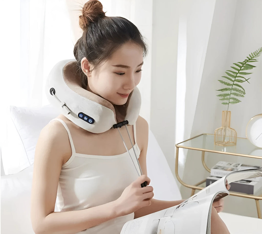 Brown U-shaped electric neck massage pillow with control buttons.