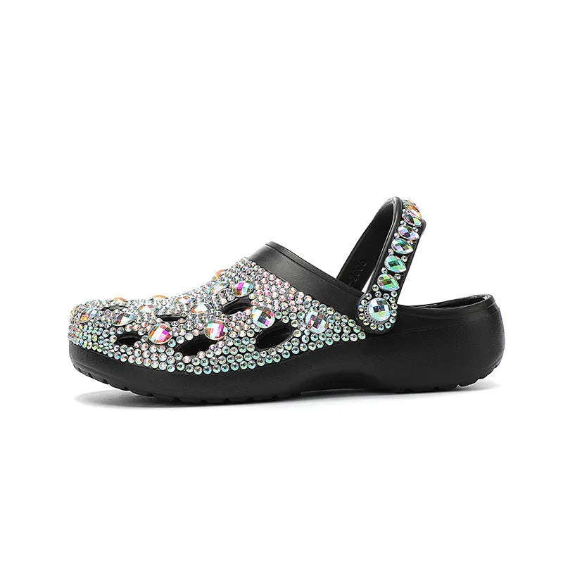 Black women's platform sandals with rhinestone decoration and multiple air holes on a white background.