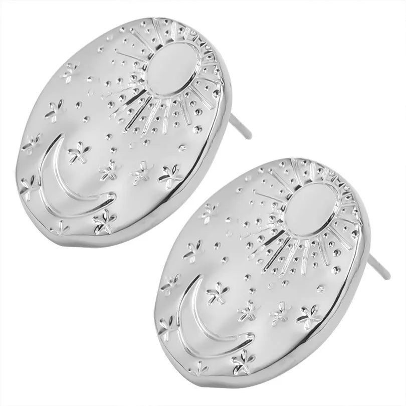 A pair of geometric stud earrings made from stainless steel with shell design details in gold colour finish.