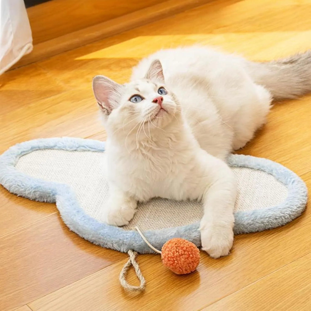 White wall-mounted cat scratching mat with sleeping cat cartoon design made from natural sisal