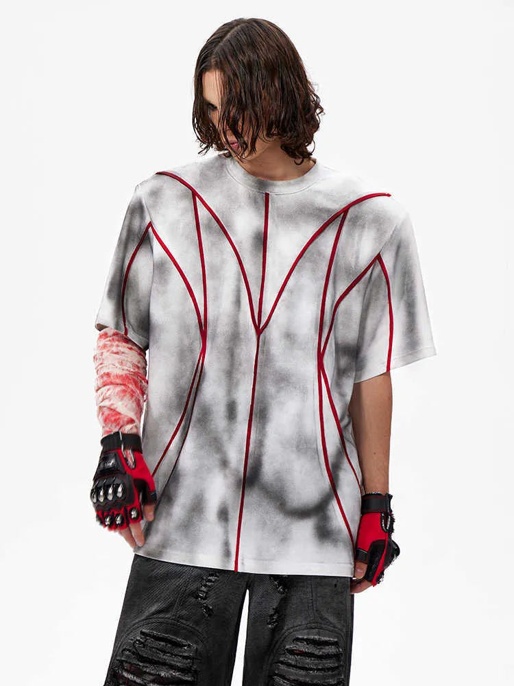 Women's light grey T-shirt with padded shoulders and textured white line patchwork detail on the front.