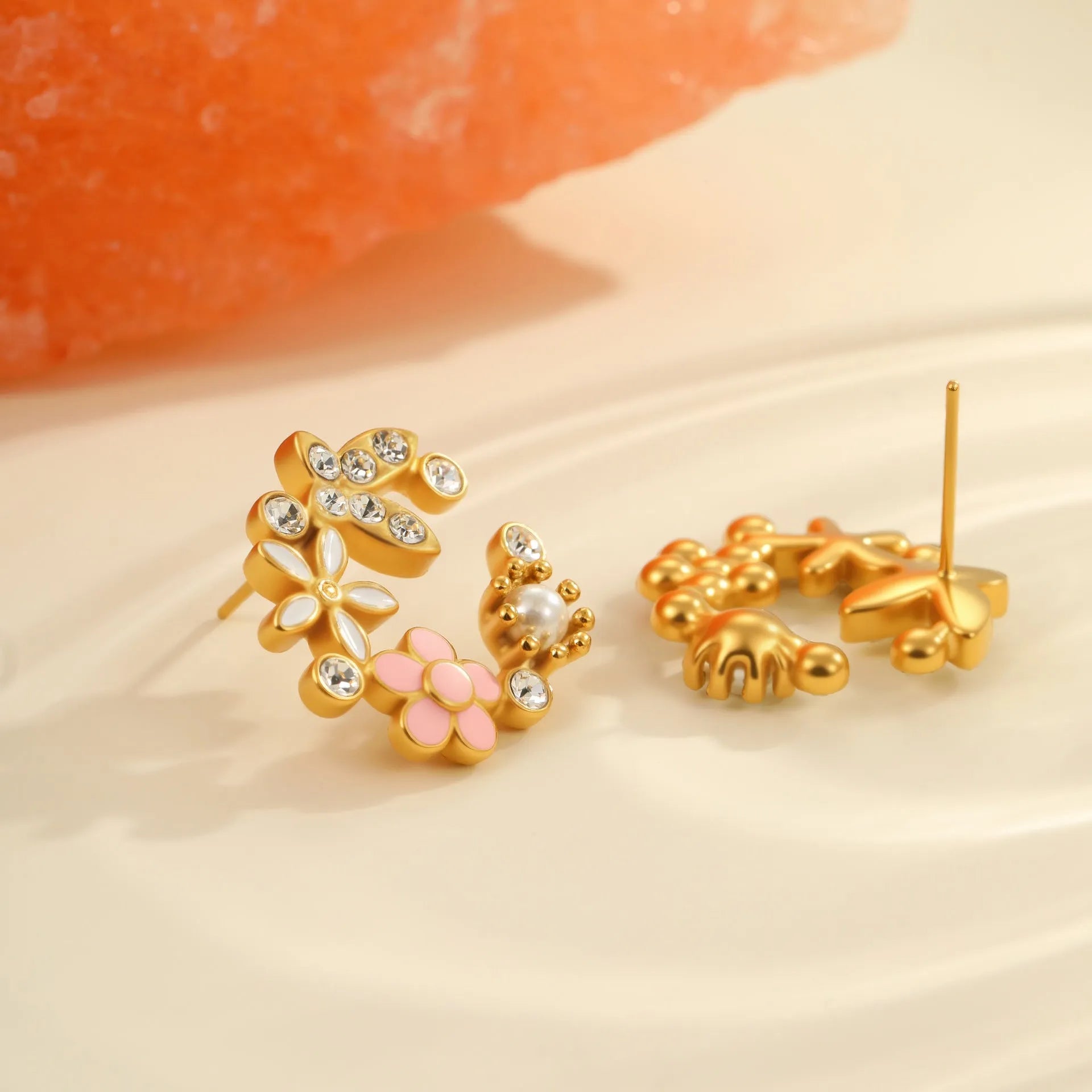 Gold plated flower stud earrings with petal design on stainless steel base