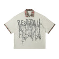 Men's loose fit short-sleeved top with graffiti print on asymmetric lapel in blue or red.