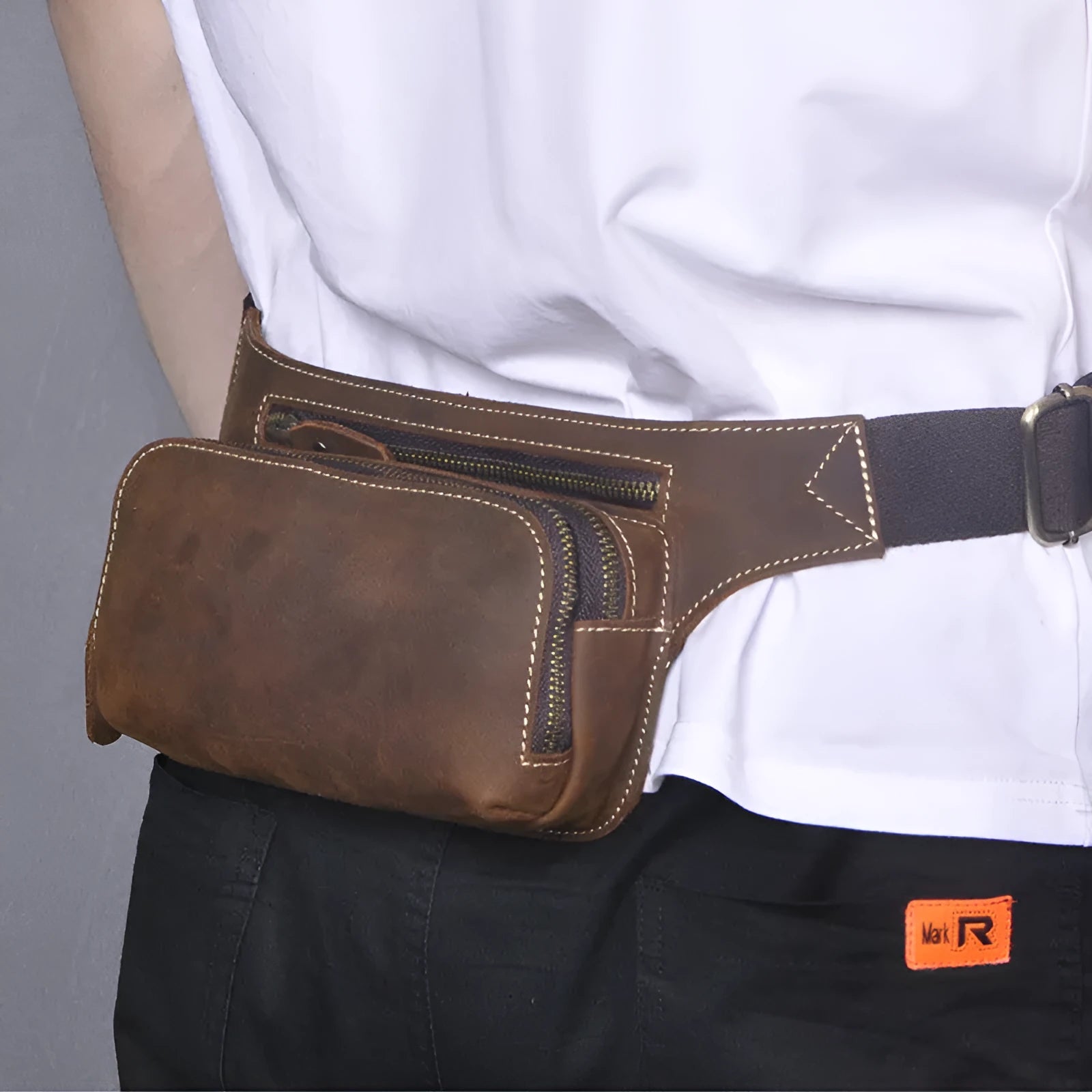 Brown cow leather men's sports waist bag showing internal phone pocket