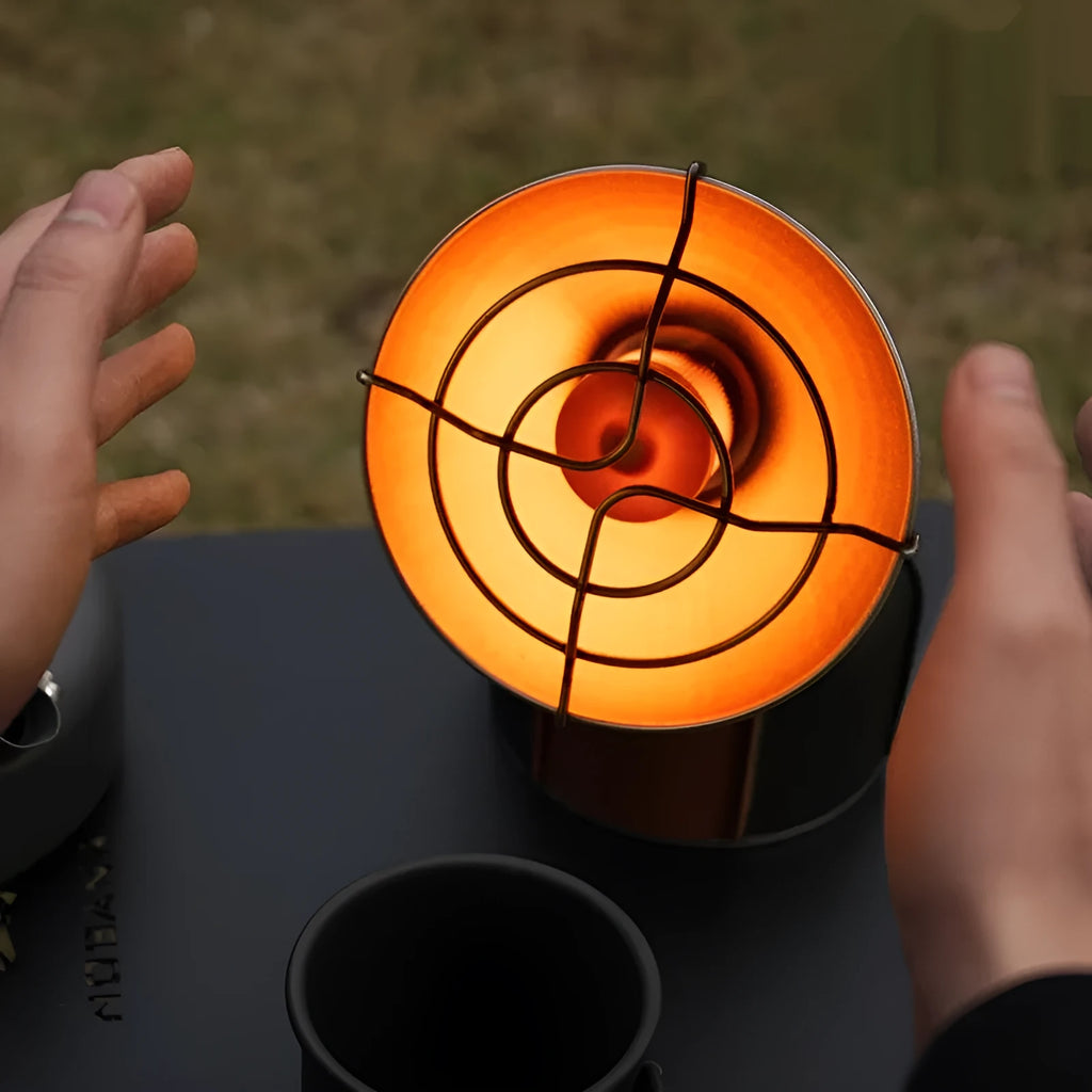 Portable outdoor heating stove with black and orange design and automatic ignition