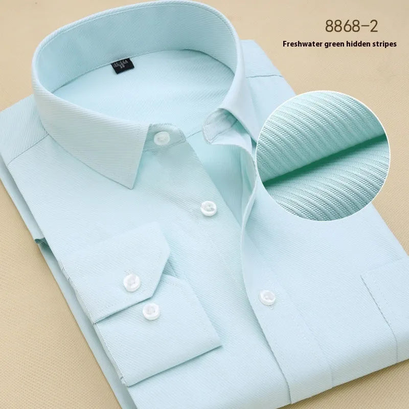 Men's black solid colour long sleeve cotton business shirt with a slim fit on a hanger.