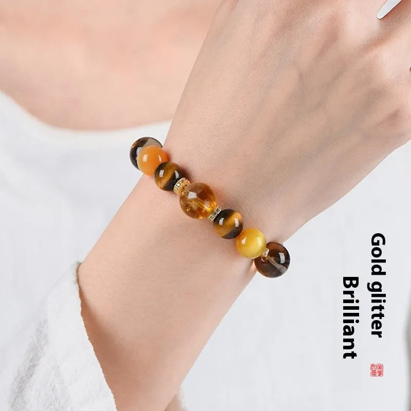 Natural yellow tower crystal string beads bracelet with 10mm Jinba design on wrist