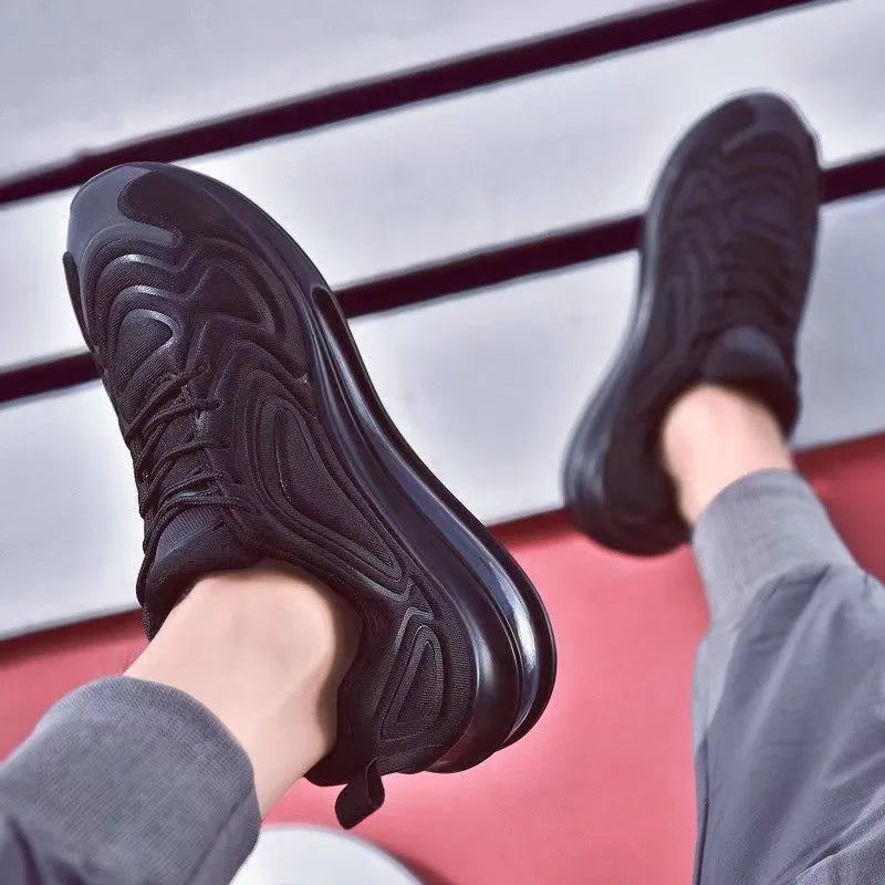 Men's black casual running sneakers with air cushion, lace-up front, and thick sole.
