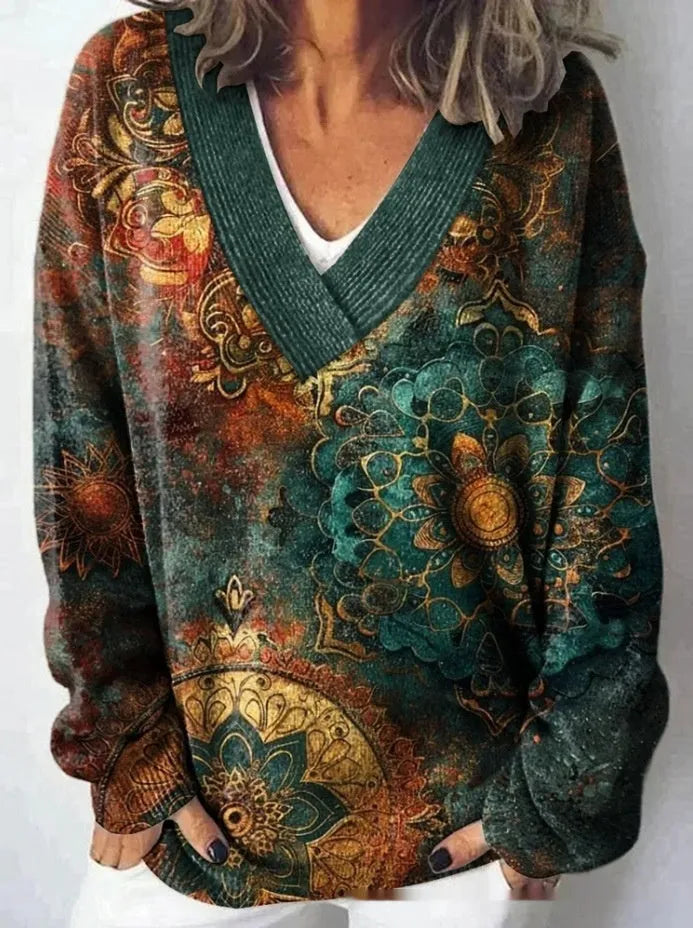 Women's V-neck sweatshirt with a white background and a textured 3D floral printed pattern.