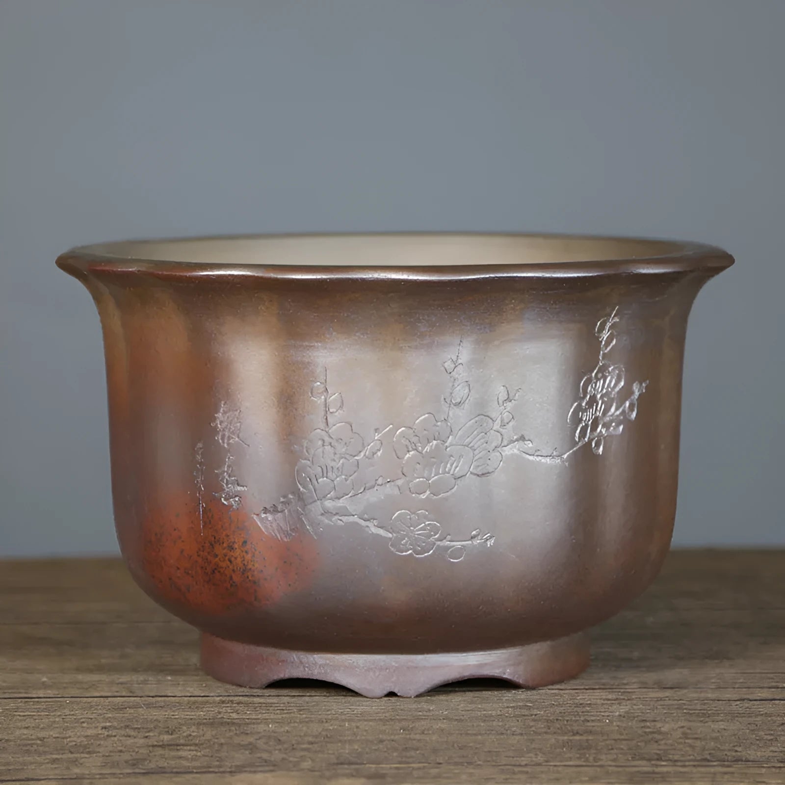 Antique carved ceramic flower pot with purple sand finish and wood burning texture