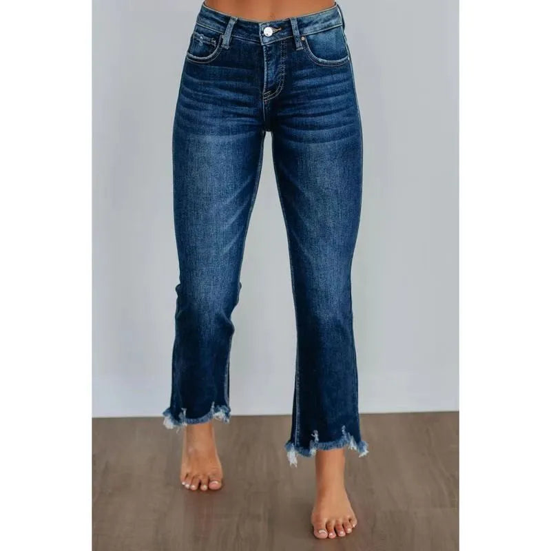 Women's dark blue cotton denim trousers with a hand-distressed casual finish.